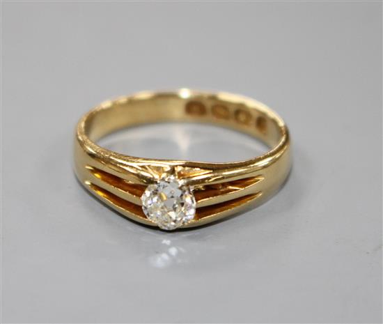 A late Victorian 18ct gold and claw set solitaire old round cut diamond ring, size O.